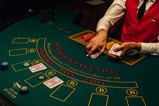 A dealer with chips and cards.